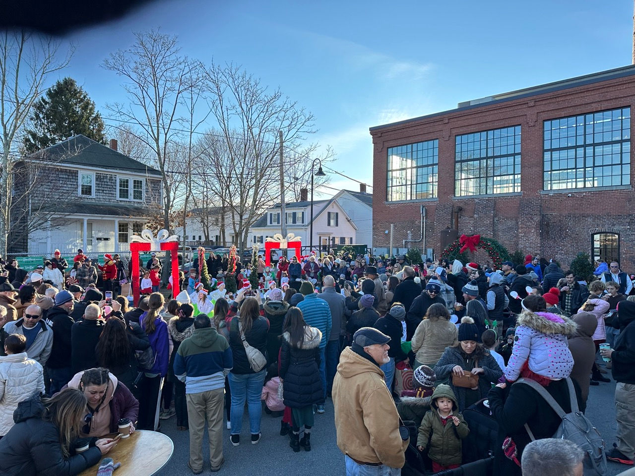 A crowd in the mill courtyard